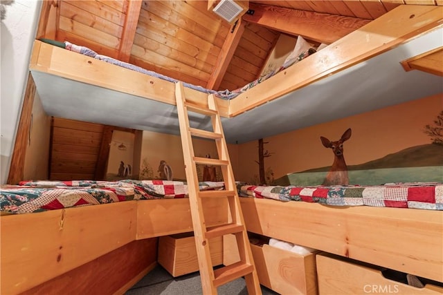 bedroom featuring wooden ceiling and carpet floors