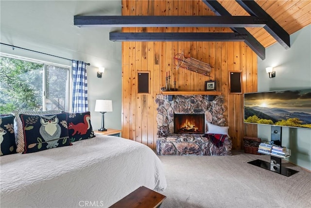 carpeted bedroom featuring wood walls, a stone fireplace, wooden ceiling, high vaulted ceiling, and beamed ceiling