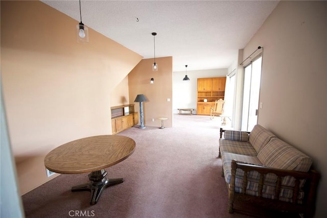 living room featuring vaulted ceiling and carpet