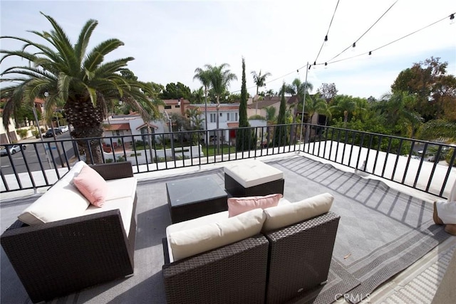 view of patio / terrace featuring an outdoor living space and a balcony