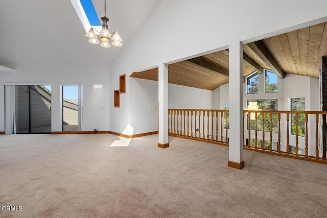 bonus room featuring a chandelier, carpet flooring, lofted ceiling with beams, and wooden ceiling