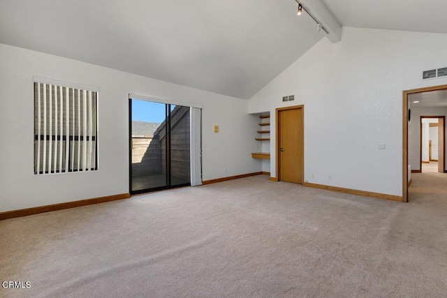 spare room with beamed ceiling, track lighting, high vaulted ceiling, and carpet floors