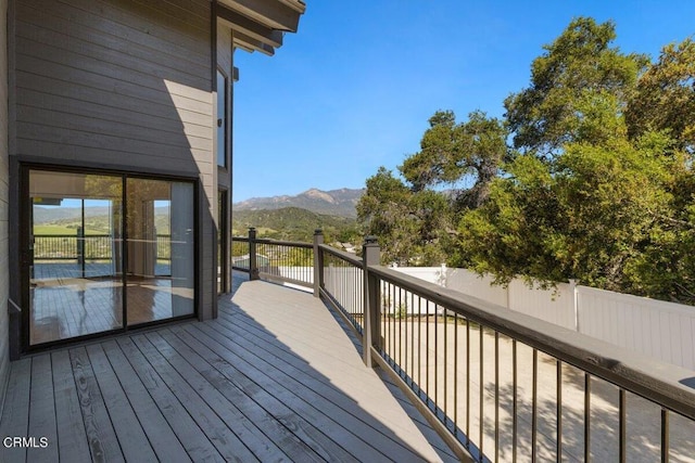 wooden deck with a mountain view