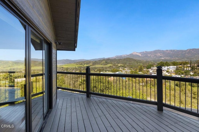 wooden terrace with a mountain view