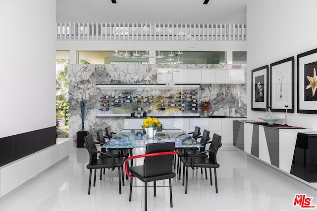 dining room featuring a high ceiling