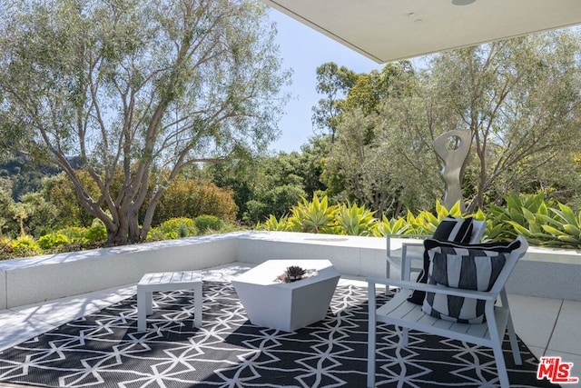 view of patio featuring a fire pit