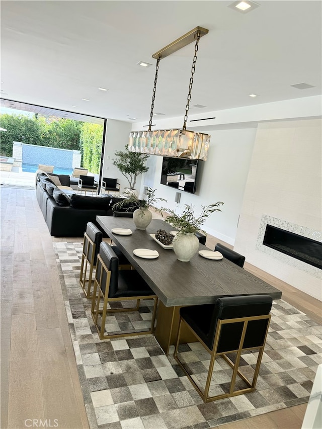 dining area with wood-type flooring