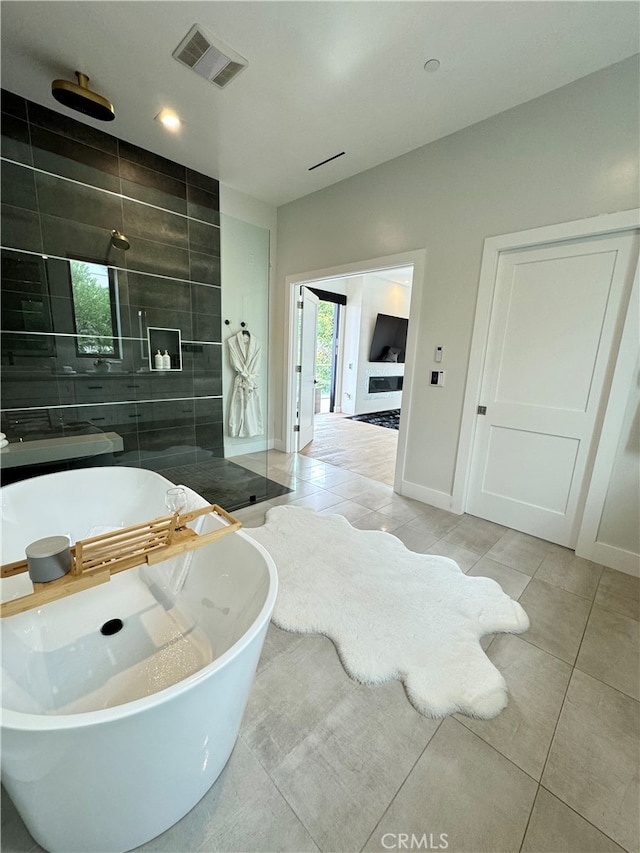 bathroom featuring tile patterned floors and plus walk in shower