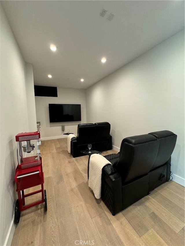 living room with light hardwood / wood-style flooring