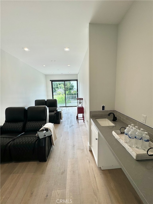 interior space with sink and wood-type flooring