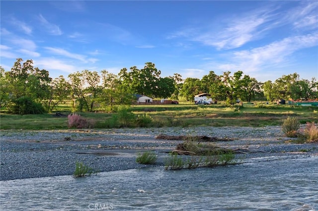 surrounding community with a water view