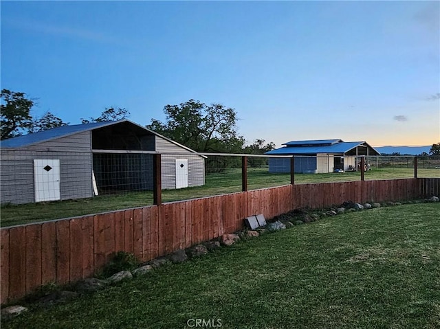 yard at dusk with an outdoor structure