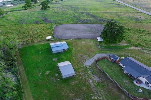 birds eye view of property with a rural view