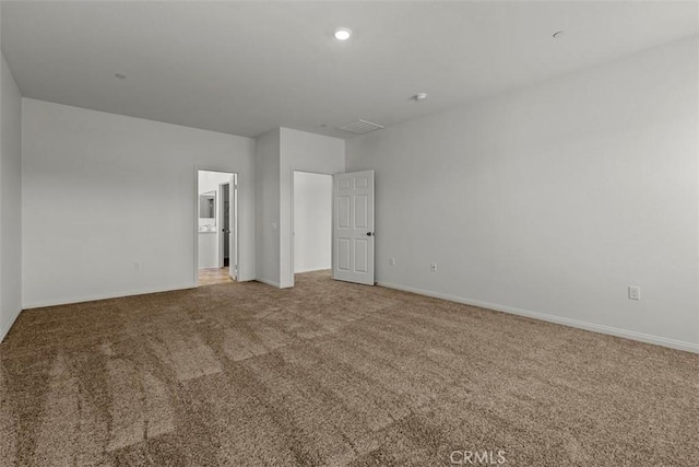 empty room featuring carpet flooring