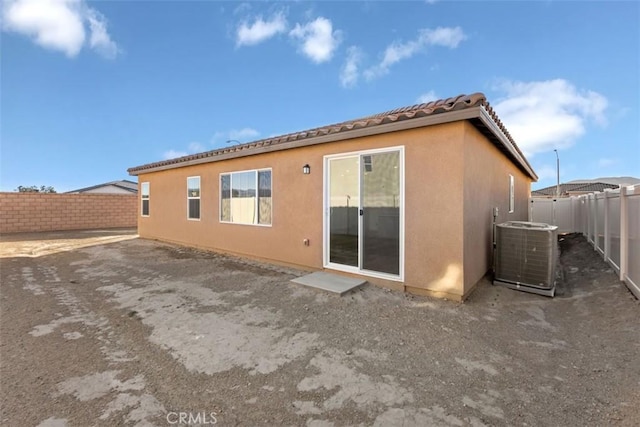 back of property with central AC unit