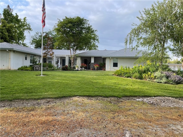 view of front of home with a front yard