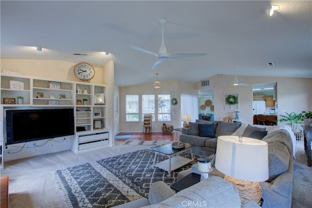 carpeted living room featuring lofted ceiling and ceiling fan