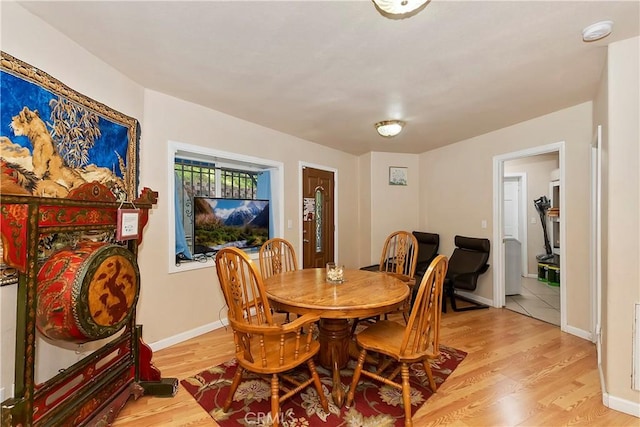 dining area with light hardwood / wood-style flooring