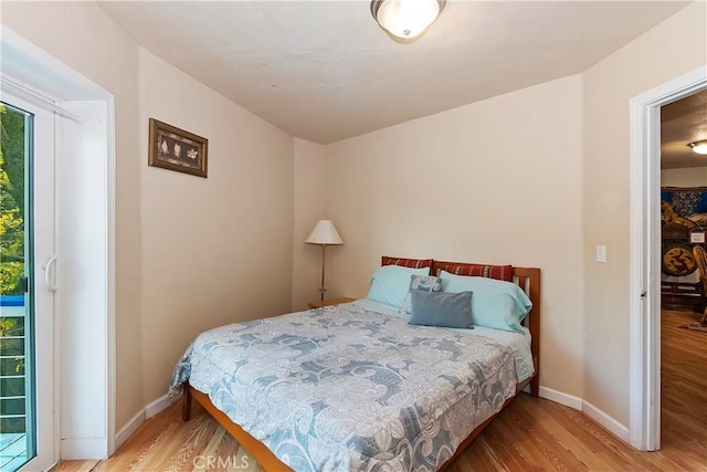 bedroom with light hardwood / wood-style flooring