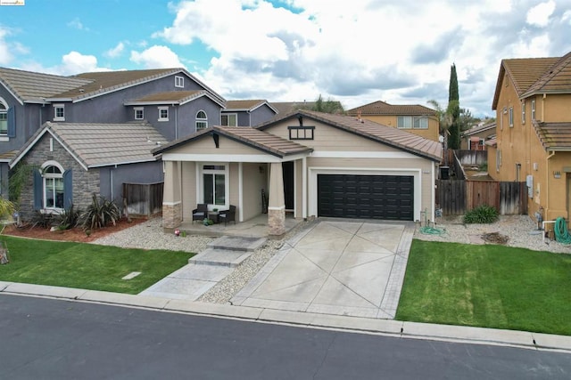 view of front of home with a front lawn and a garage