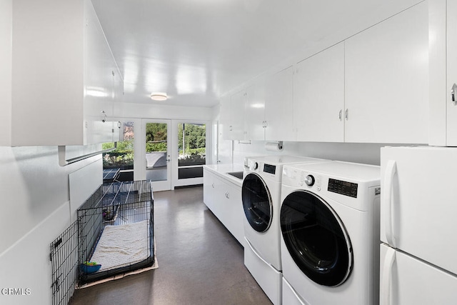 washroom featuring french doors, cabinets, and separate washer and dryer