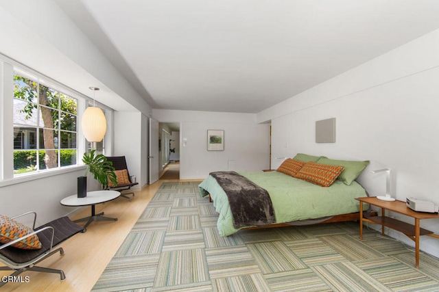 bedroom featuring hardwood / wood-style flooring