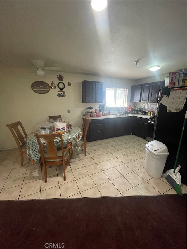 interior space featuring sink and ceiling fan