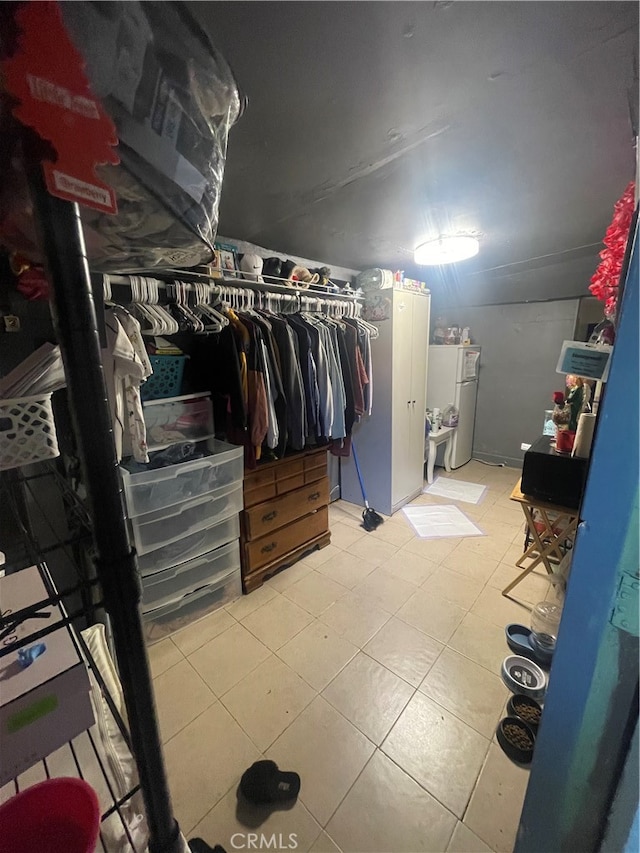 spacious closet featuring light tile floors