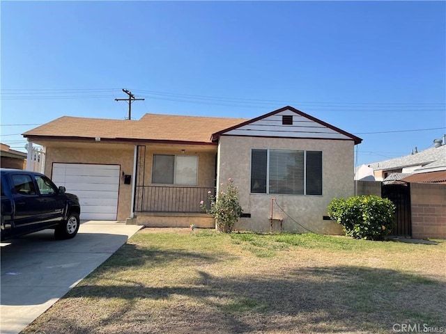 view of front facade with a front yard and a garage