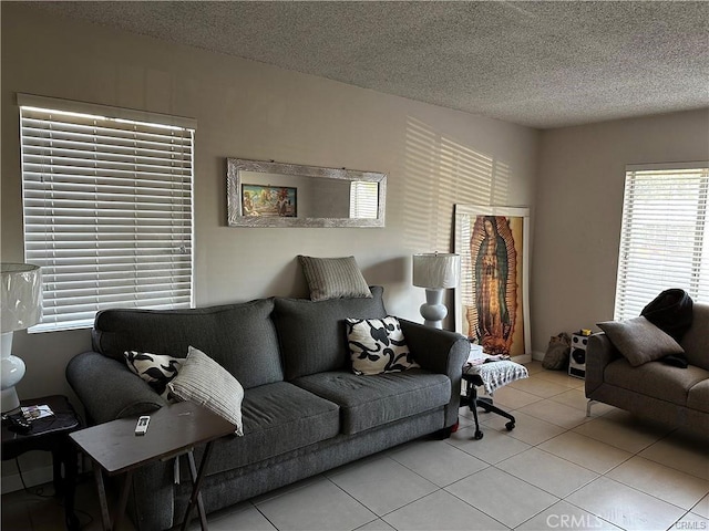 tiled living room with a textured ceiling