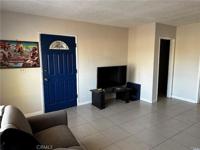 tiled living room with a textured ceiling