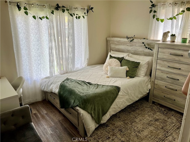 bedroom featuring dark wood-type flooring