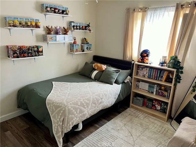 bedroom with wood-type flooring