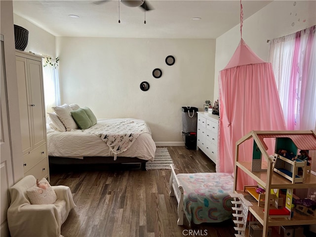 bedroom featuring dark wood-type flooring and ceiling fan