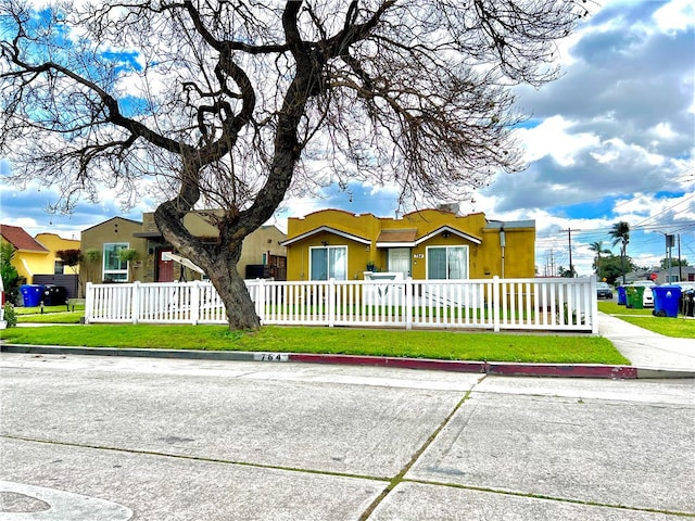 ranch-style house with a front lawn