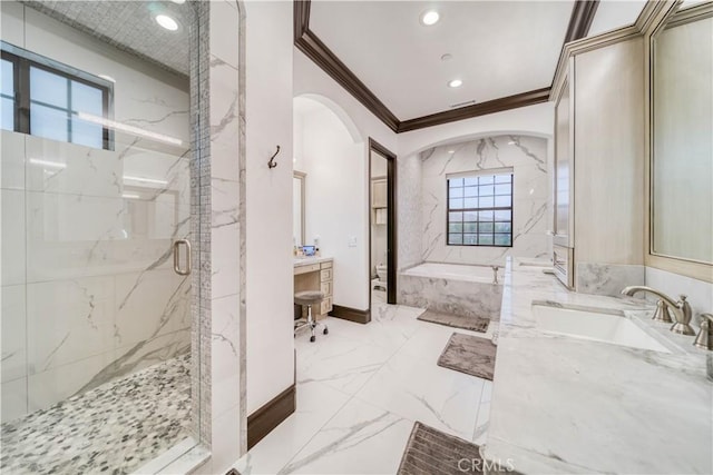 bathroom featuring crown molding, separate shower and tub, and vanity