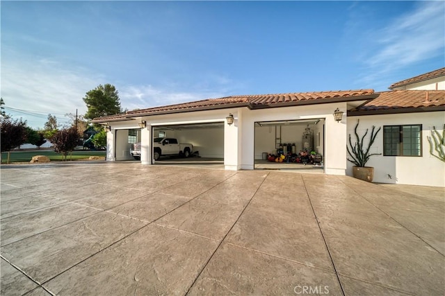 view of side of property featuring a garage