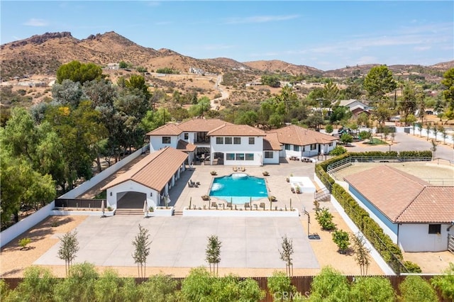 birds eye view of property with a mountain view