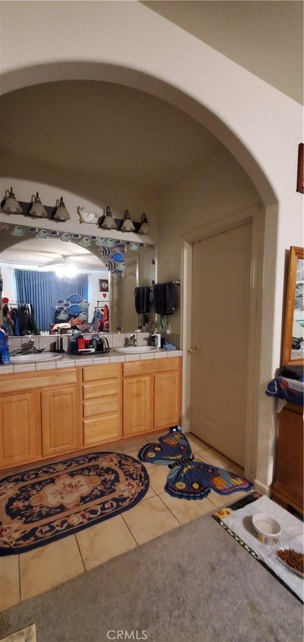 bathroom with tile patterned flooring and vanity