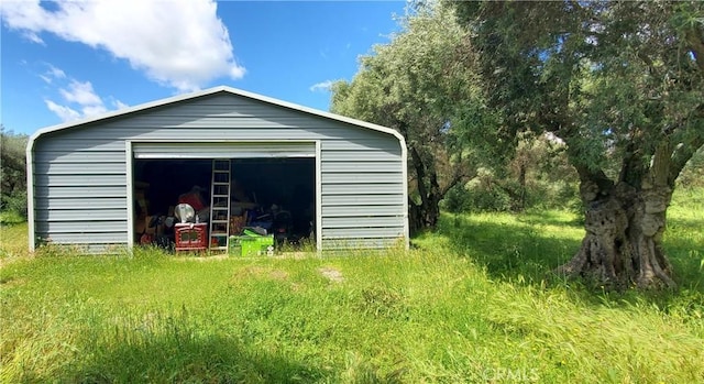 view of outdoor structure with a garage