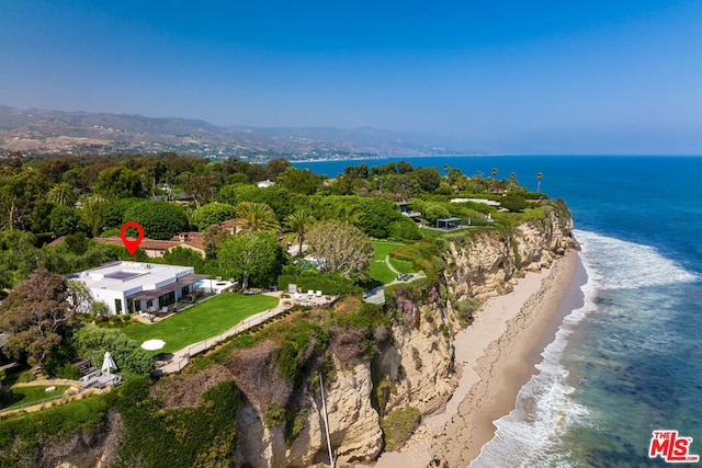 birds eye view of property featuring a view of the beach and a water view