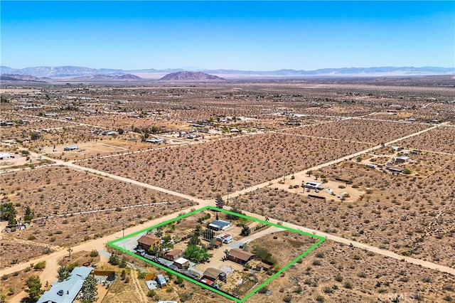 birds eye view of property featuring a mountain view