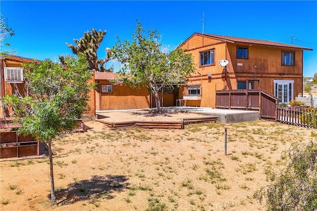 back of property with fence