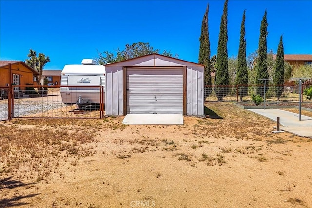 garage featuring fence
