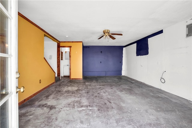 unfurnished room featuring concrete floors, ceiling fan, and crown molding