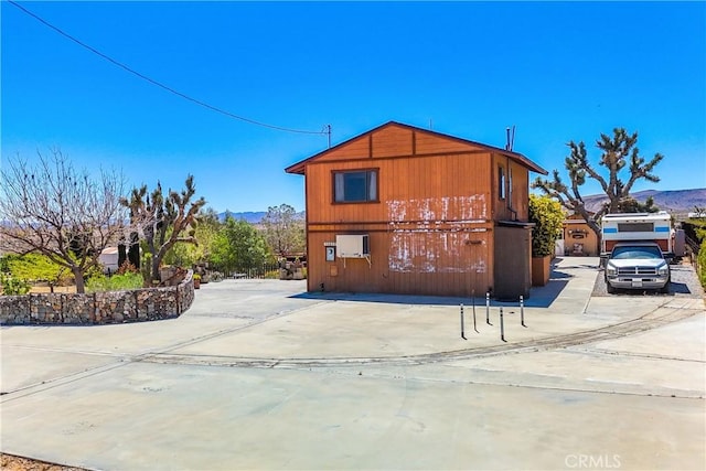 view of side of property featuring a mountain view
