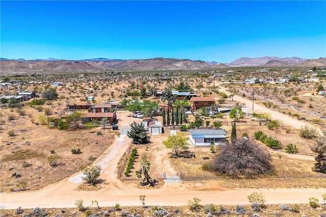 birds eye view of property with a mountain view