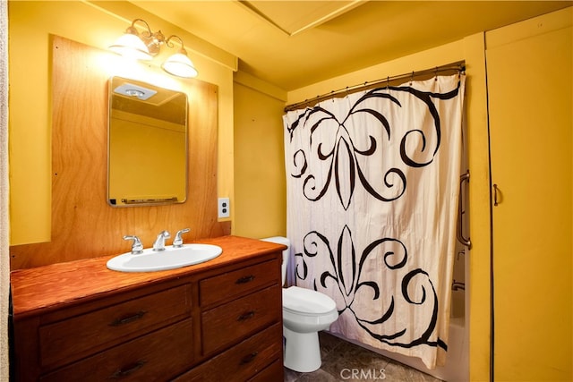 bathroom featuring vanity, toilet, and tile floors