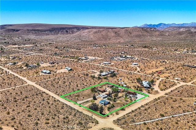 bird's eye view featuring a mountain view, view of desert, and a rural view