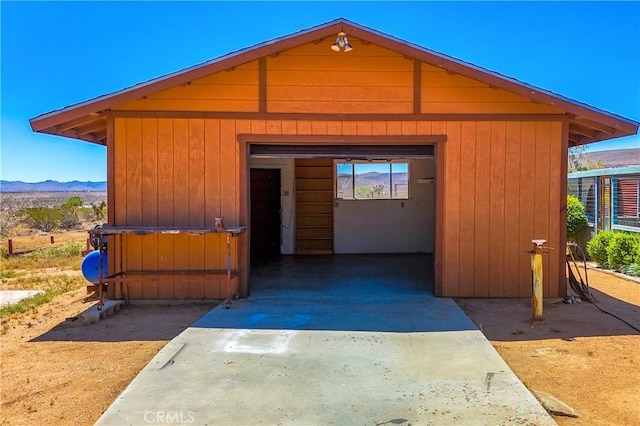 view of outdoor structure featuring an outbuilding and a mountain view
